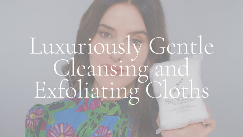 Poster image with white overlay for a video. Lisa Eldridge is in front of a grey background, holding a bag of Seamless Skin Clothes. On top of the image is the text, “Luxuriously Gentle Cleansing & Exfoliating Cloths”.