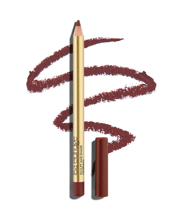 block 'Dirty' berry lip pencil with gold barrel and shade-matching cap, shown with a shade swatch behind, demonstrating the product's tones and texture.