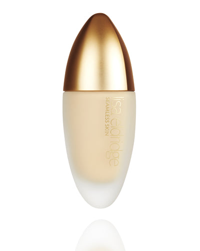 Lisa Eldridge Seamless Skin Foundation in a matte glass bottle with a gold lid. The bottle says ‘lisa eldridge SEAMLESS SKIN’