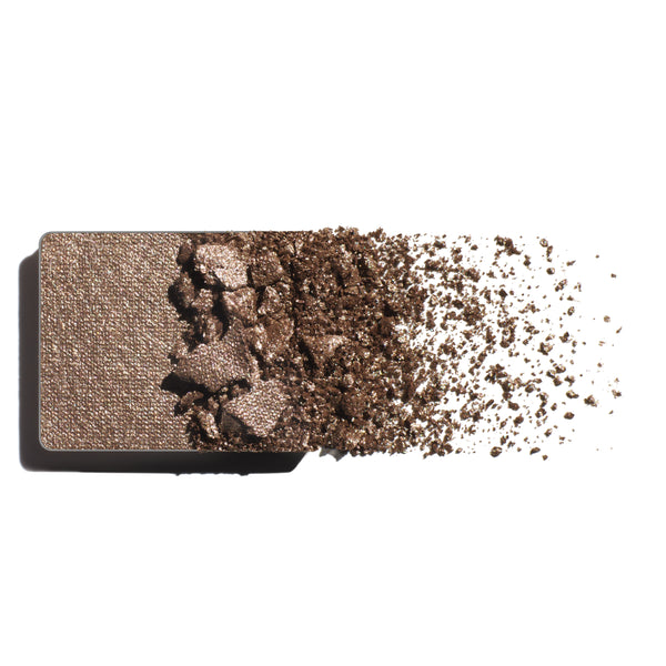 Makeup eyeshadow refill with silvery mink powder on a white background