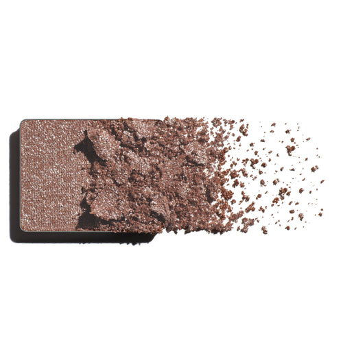 Makeup eyeshadow refill with rose pink and silver powder on a white background