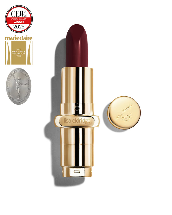 Deep claret coloured lipstick with gold casing and 'Lisa Eldridge' branding on a white background, featuring a CEW Beauty Award 2025 badge.