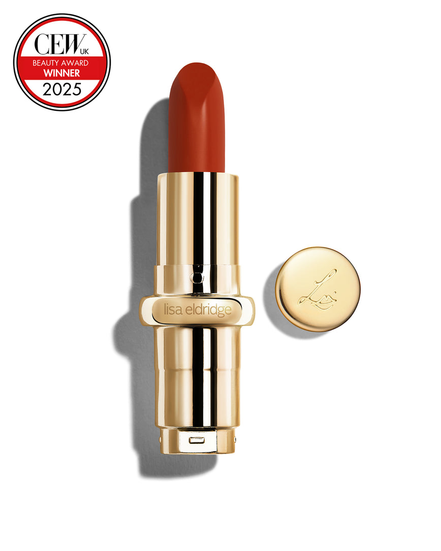 Chilli-red coloured lipstick with gold casing and 'Lisa Eldridge' branding on a white background, featuring a CEW Beauty Award 2025 badge.