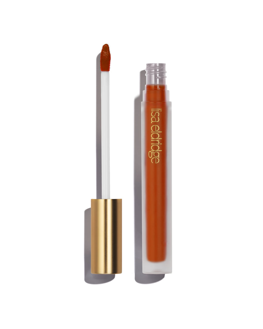 Orange-red Dragon Velveteen Liquid Lip Colour with open gold cap, frosted bottle on a white background, with lisa eldridge branding featuring a CEW Beauty Award Winner 2024 badge.