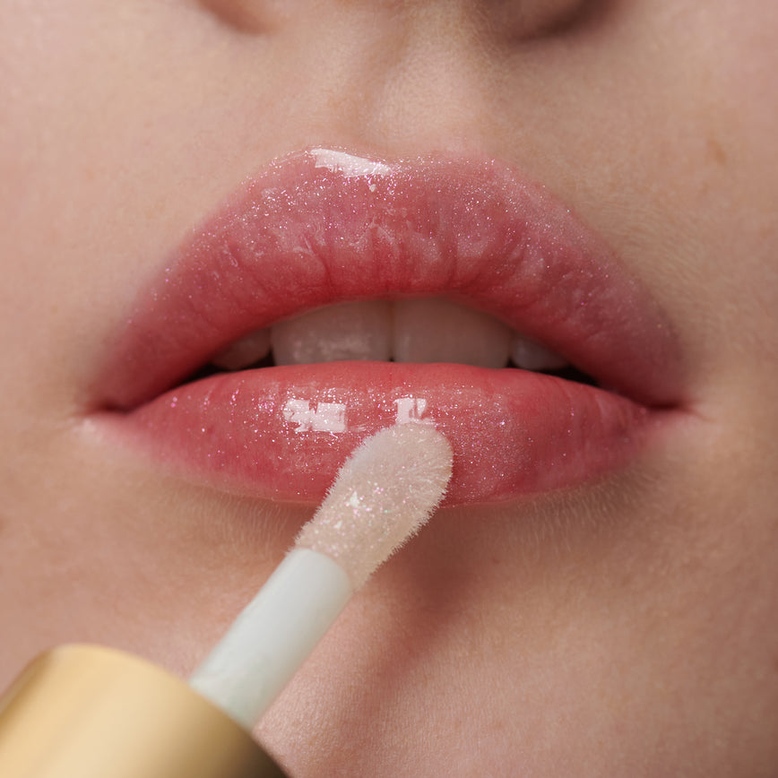 model wearing Gloss Embrace Lip Gloss in shade Dancing Rose