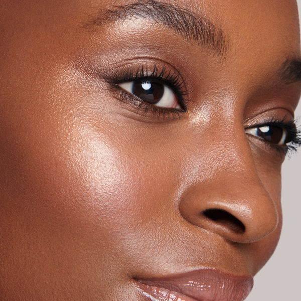 Lisa Eldridge Elevated Glow Highlighter in shade Celestial Fire pictured on model