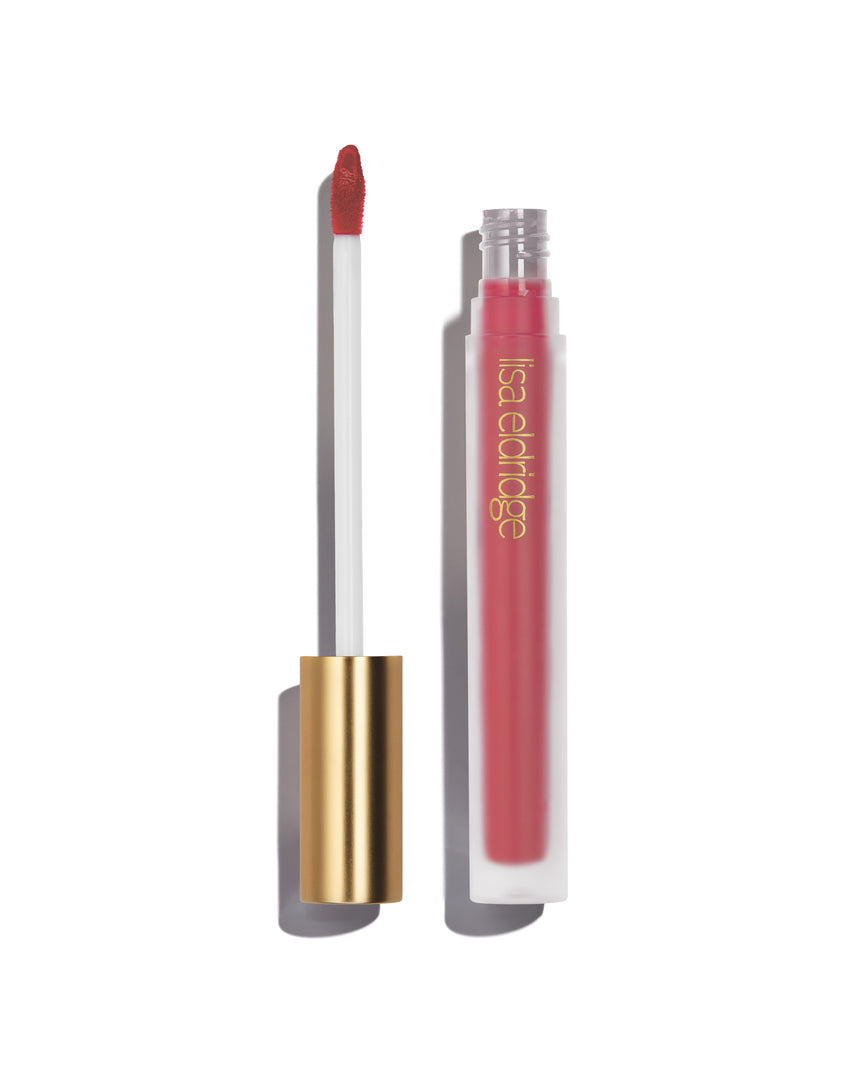 Medium pink Rain Velveteen Liquid Lip Colour with open gold cap, frosted bottle on a white background, with lisa eldridge branding featuring a CEW Beauty Award Winner 2024 badge.