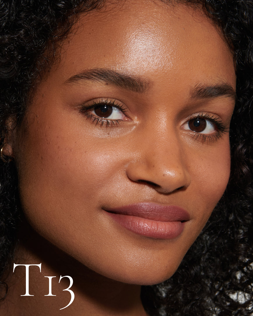 numbered howtouse Close up portrait of model wearing T13 with text displaying so