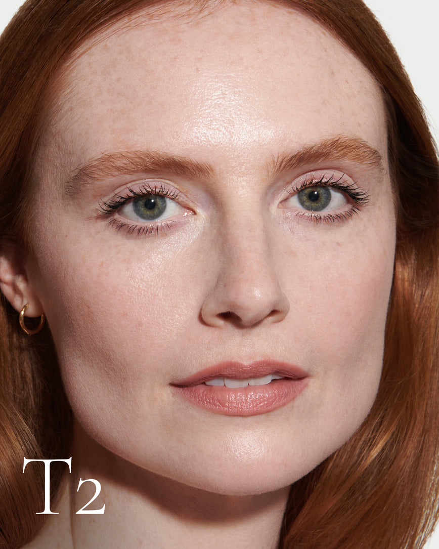 numbered Close up portrait of model wearing T2 with text displaying so