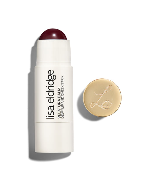 Lisa Eldridge Velatura Balm stick in Hellebore Heaven shade, with cream packaging and golden logo-embossed cap, on a white background