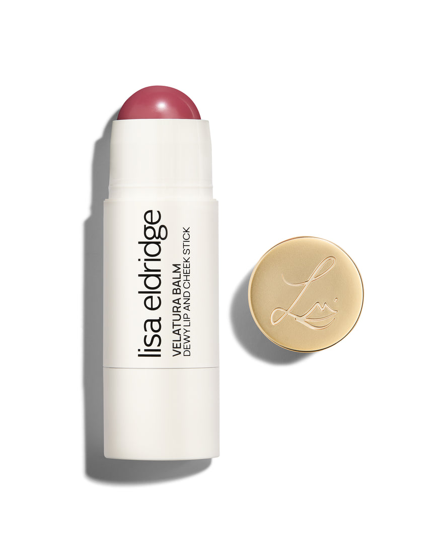 Lisa Eldridge Velatura Balm stick in Rose Madder shade, with cream packaging and golden logo-embossed cap, on a white background