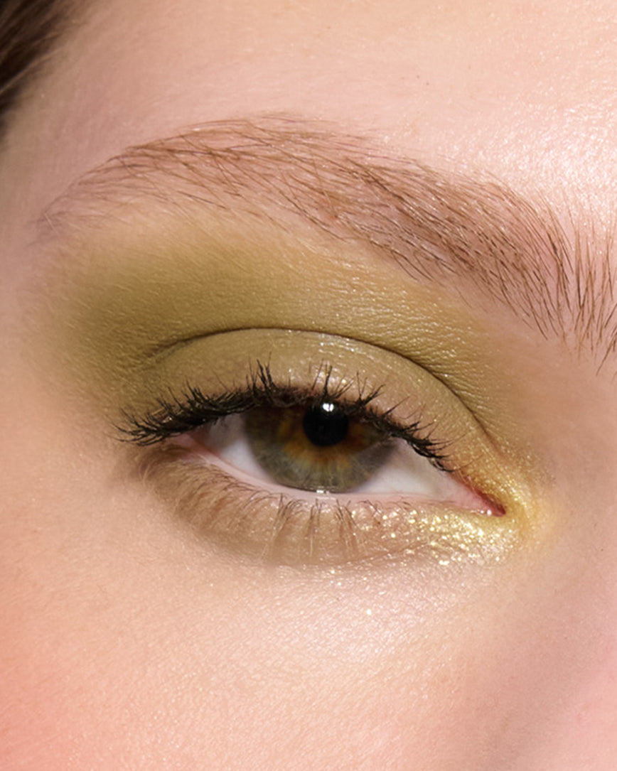 Extreme close-up of an eye with khaki eyeshadow from Desert Gleam Eyeshadow Palette