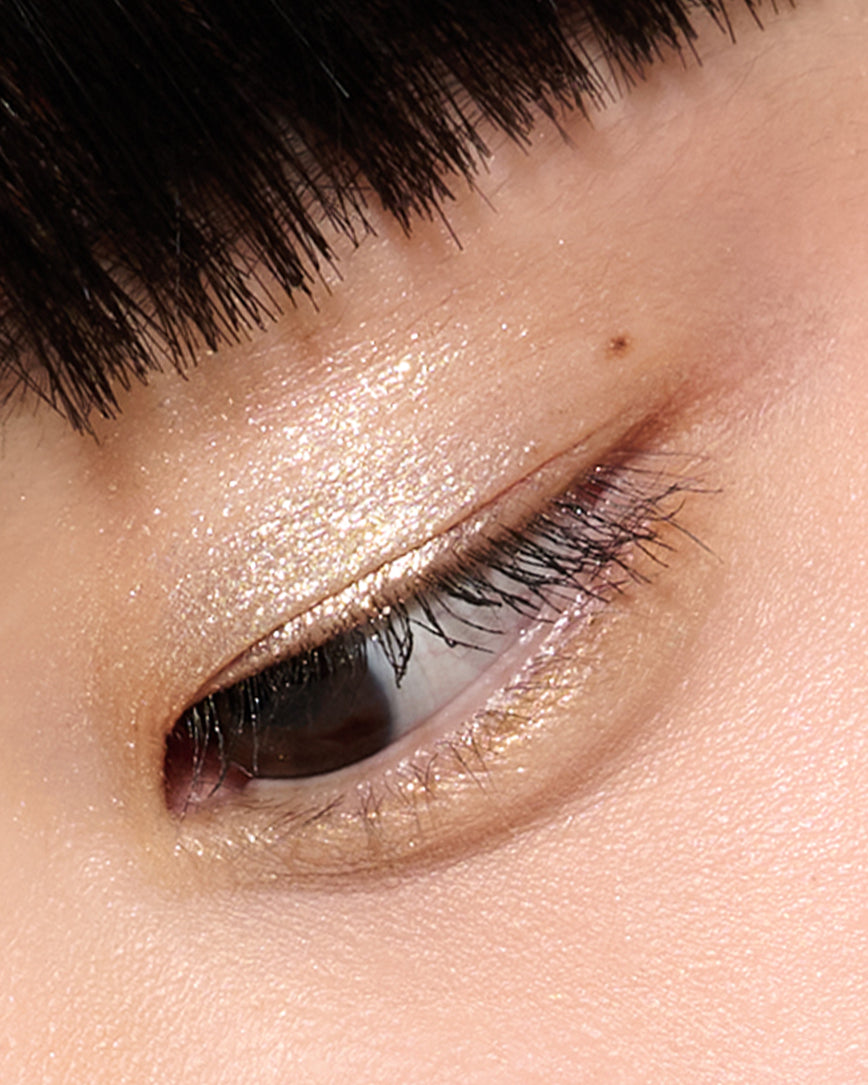 Extreme close-up of an eye with  champagne eyeshadow from Desert Gleam Eyeshadow Palette