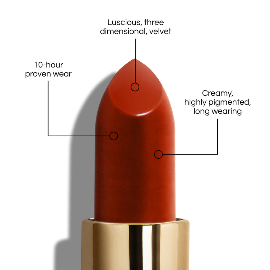 True Velvet Lip Colour bullet close-up, with text demonstrating it's benefits: Lucious, three dimensional, velvet. 10-hour proven wear. Creamy, highly pigmented, long wearing. In shade Dragon.