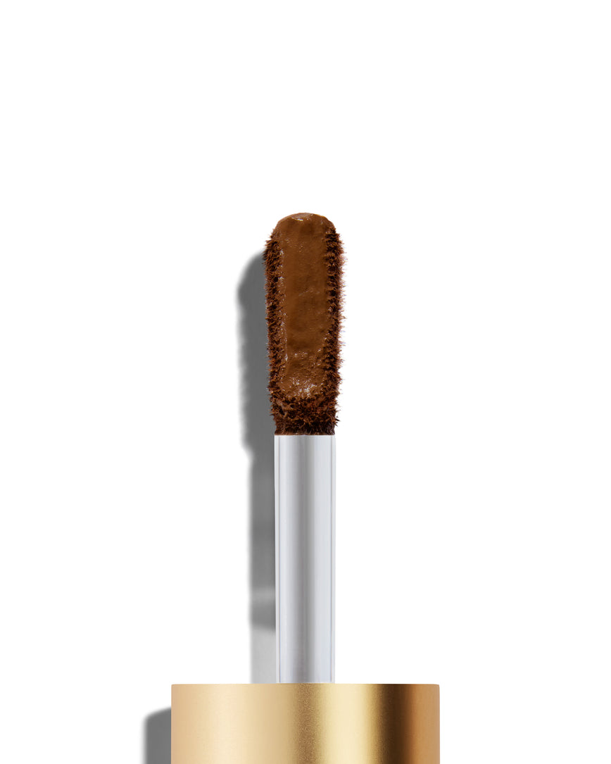 Portrait close-up of model wearing golden brown Liquid Silk eyeshadow