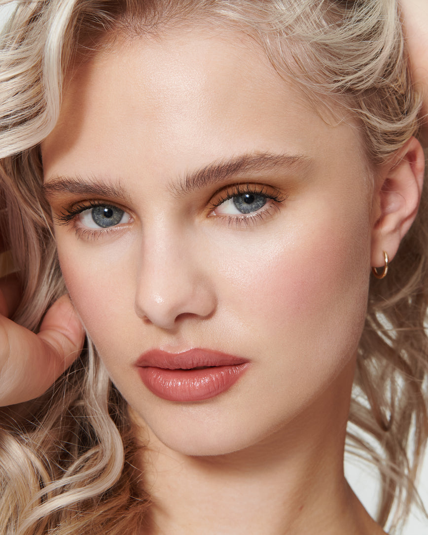 Portrait close-up of model wearing golden brown Gaia Liquid Silk eyeshadow