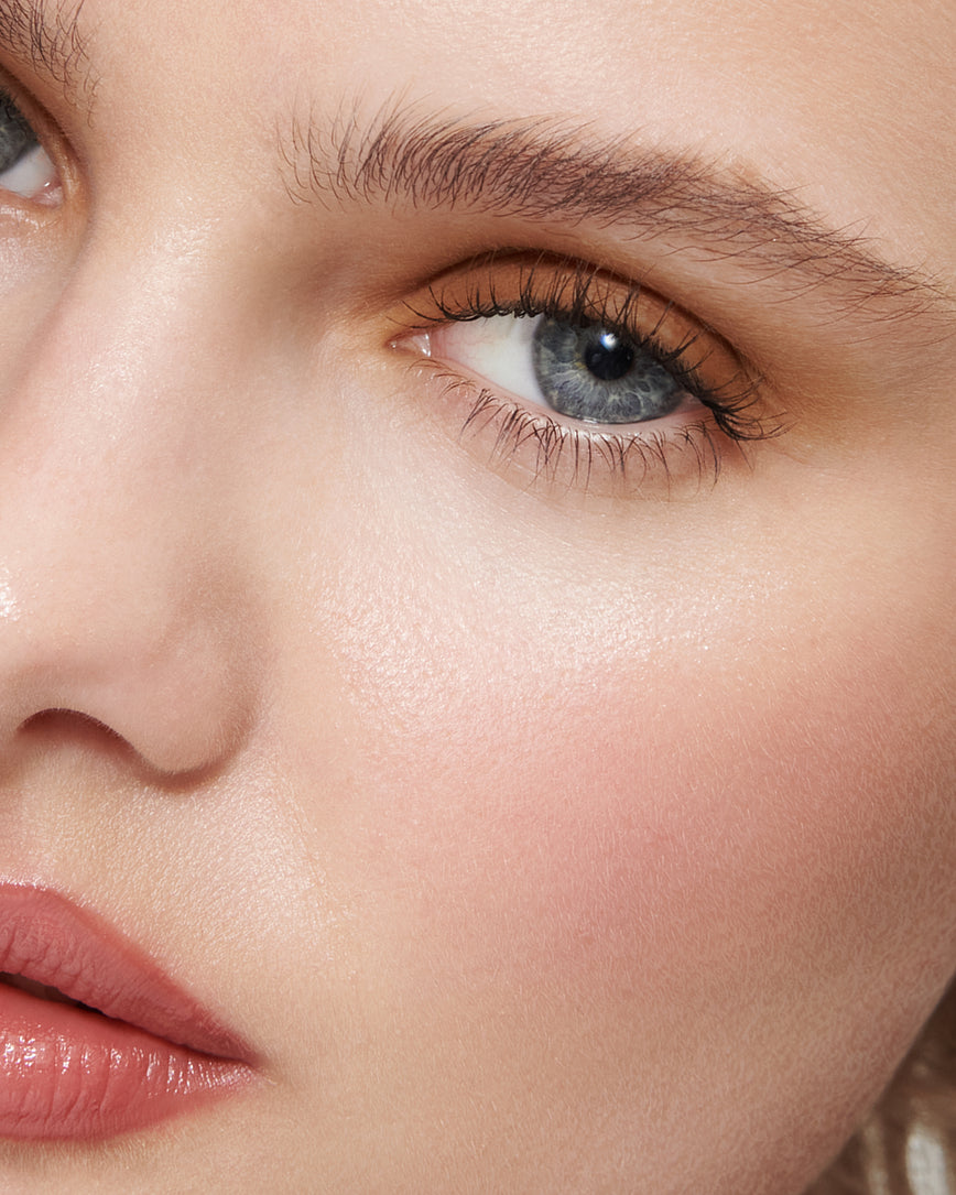 Extreme close-up of model's eye wearing golden brown Gaia Liquid Silk eyeshadow