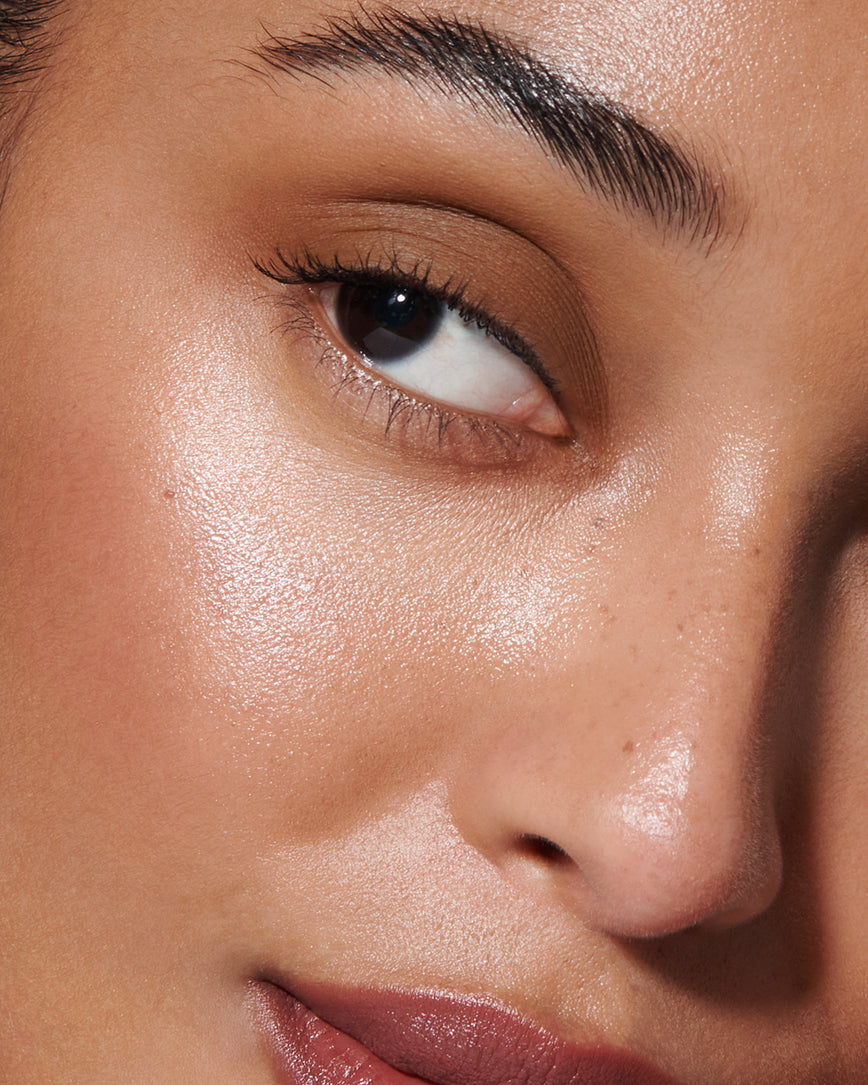 Extreme close-up of model's eye wearing golden brown Gaia Liquid Silk eyeshadow