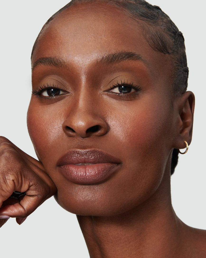 Portrait close-up of model wearing golden brown Gaia Liquid Silk eyeshadow