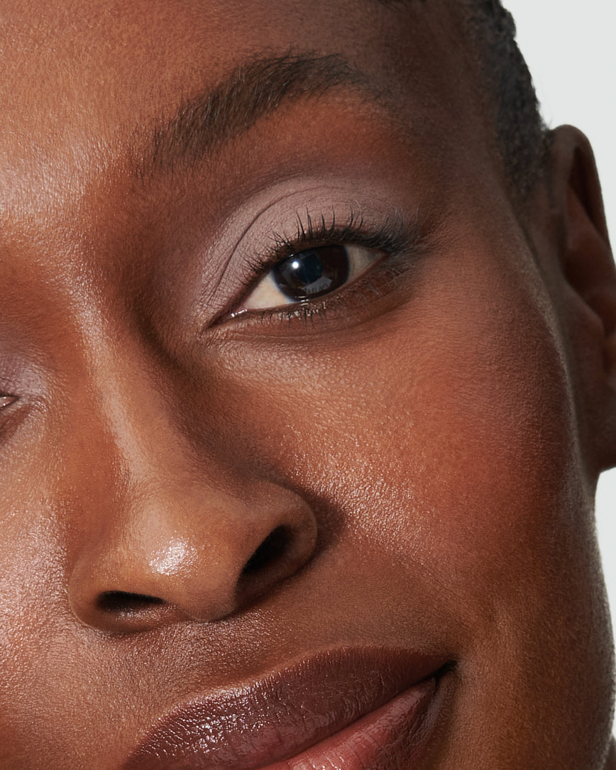 Portrait close-up of model wearing cool mauve Ione Liquid Silk eyeshadow
