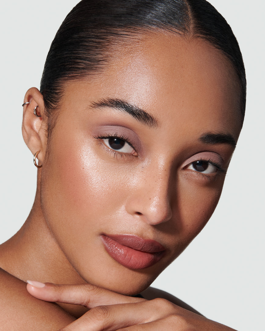 Portrait close-up of model wearing cool mauve Ione Liquid Silk eyeshadow