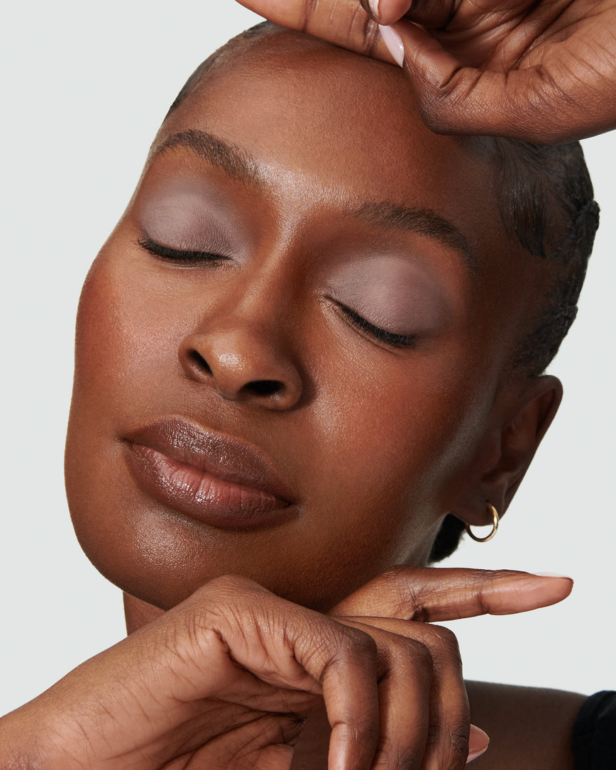Portrait close-up of model wearing cool mauve Ione Liquid Silk eyeshadow