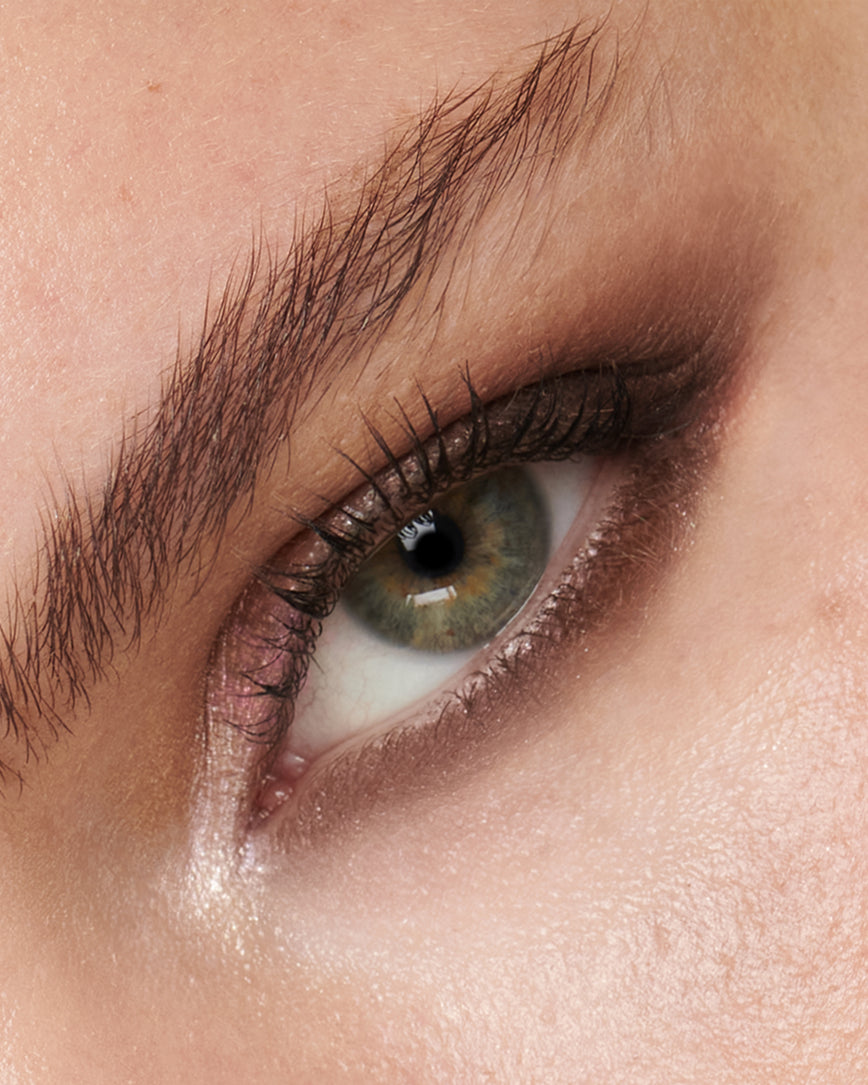 Extreme close-up of an eye with pink and brown eyeshadow from Fawn Eyeshadow Palette