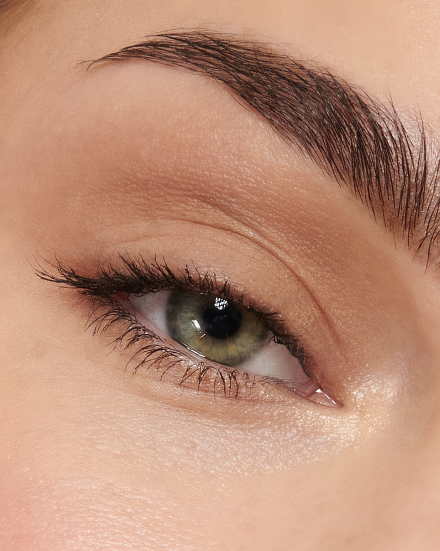 Extreme close-up of an eye with beige eyeshadow from Fawn Eyeshadow Palette