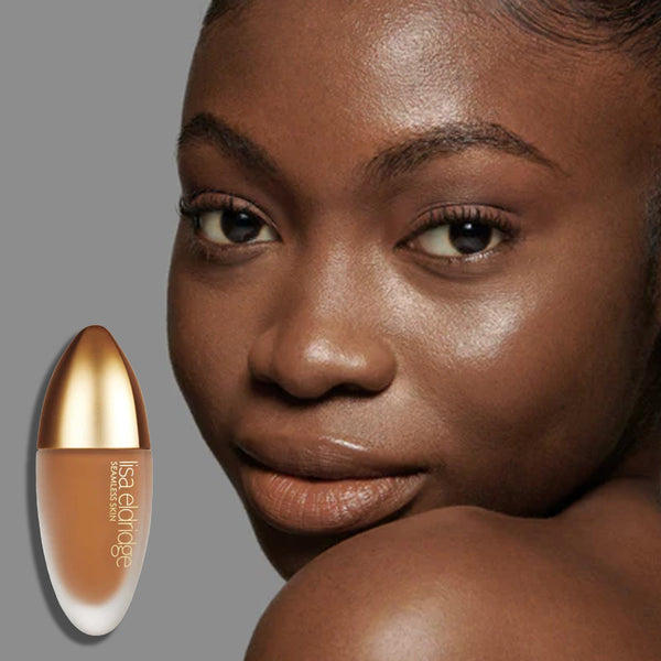 Model wearingThe Foundation with the product in the foreground, on a neutral background