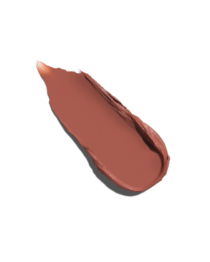 Tawny caramel swatch, lipstick swipe to display the shade and texture, on a white background
