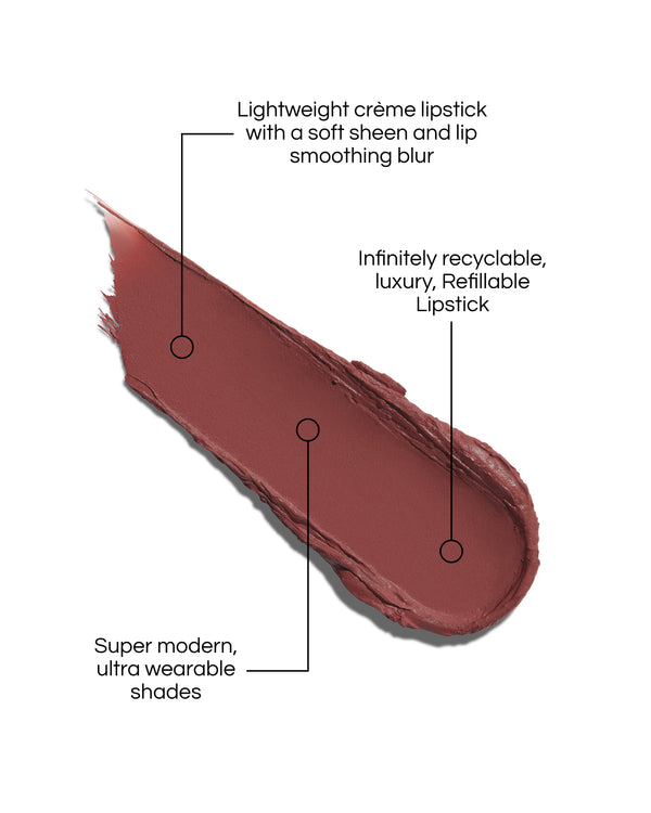 Rouge Experience Lipstick swatch with text describing features on a white background, in shade Medici. Text reads: Lightweight creme lipstick with a soft sheen and lip smoothing blur. Infinitely recyclable, luxury, Refillable Lipstick. Super modern, ultra wearable shades.