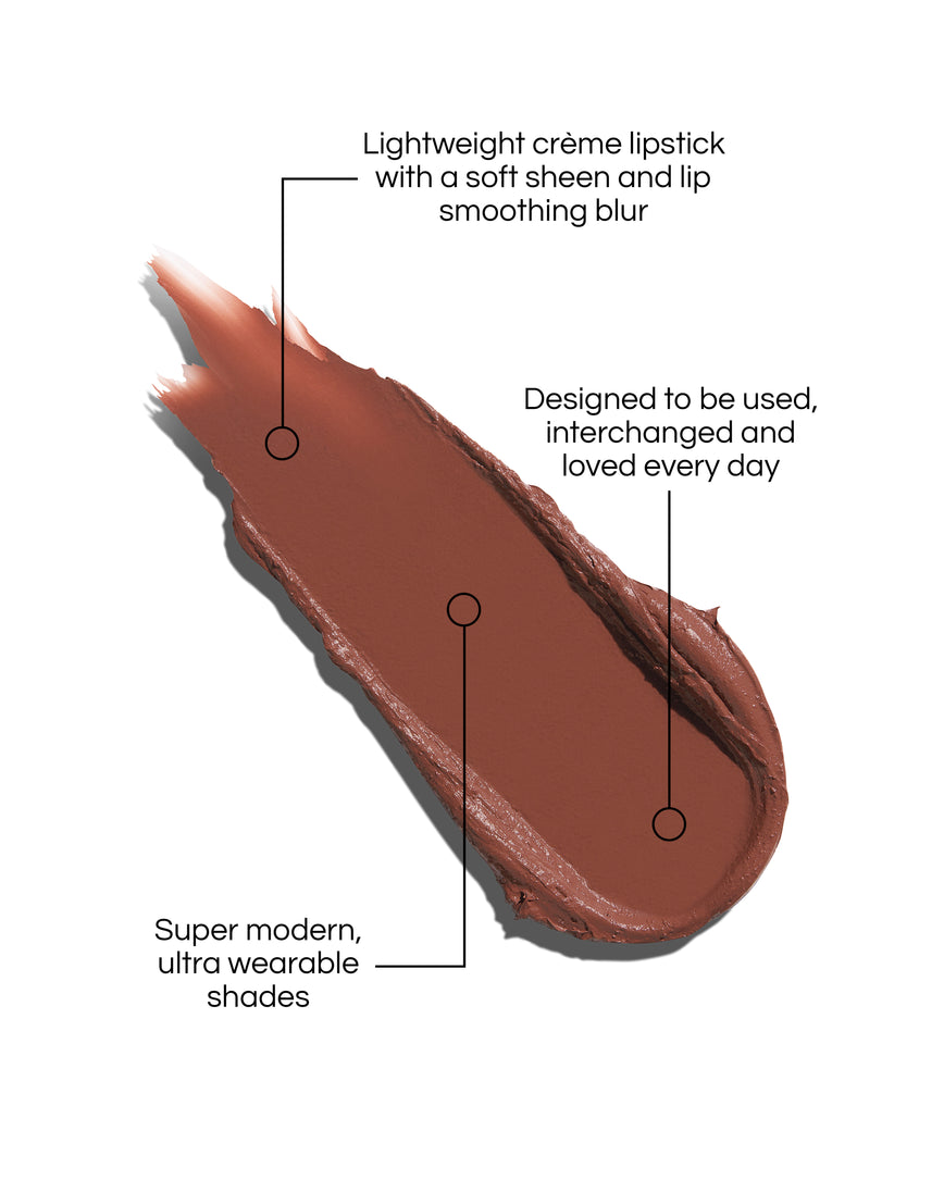 Rouge Experience Lipstick Refill swatch with text describing features on a white background, in shade Rae. Text reads: Lightweight creme lipstick with a soft sheen and lip smoothing blur. Designed to be used, interchanged and loved every day. Super modern, ultra wearable shades.
