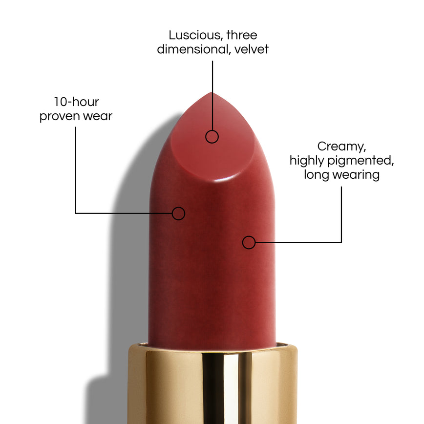 True Velvet Lip Colour bullet close-up, with text demonstrating it's benefits: Lucious, three dimensional, velvet. 10-hour proven wear. Creamy, highly pigmented, long wearing. In shade Rain.