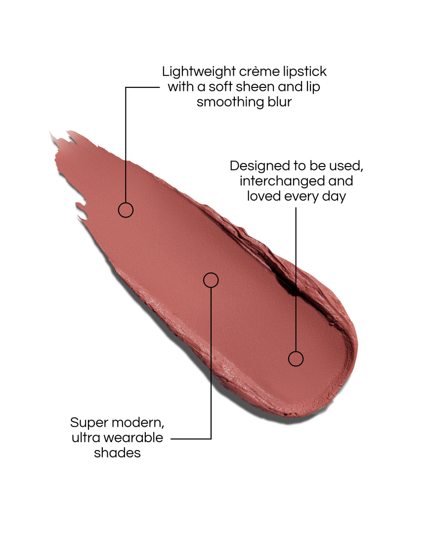 Rouge Experience Lipstick Refill swatch with text describing features on a white background, in shade Romy. Text reads: Lightweight creme lipstick with a soft sheen and lip smoothing blur. Designed to be used, interchanged and loved every day. Super modern, ultra wearable shades.