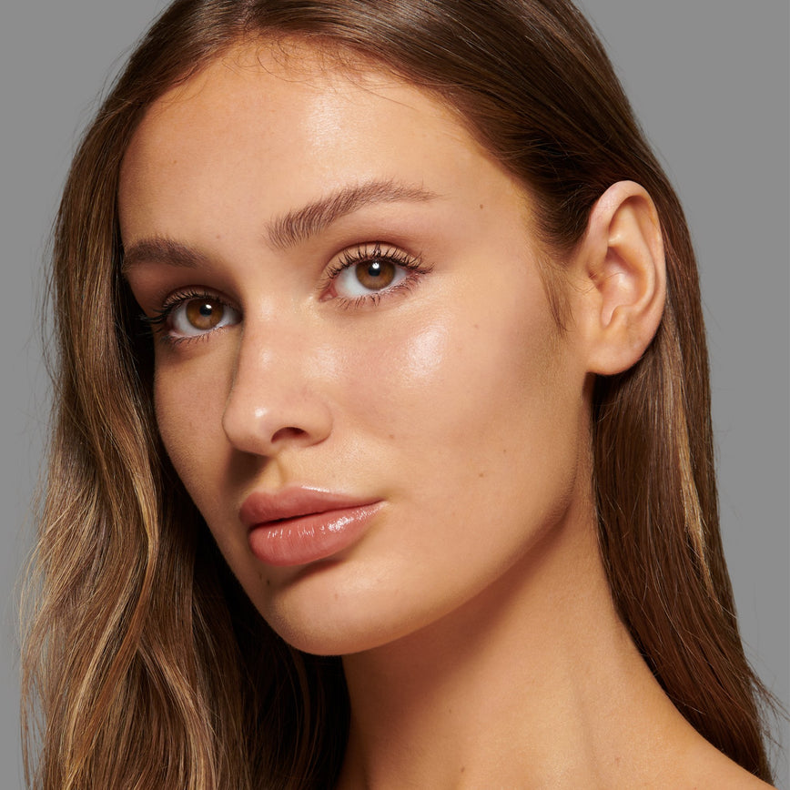 Lisa Eldridge Seamless Skin Foundation Pictured on Model. The model has light/medium skin and golden undertones, brown eyes and straight brown hair.