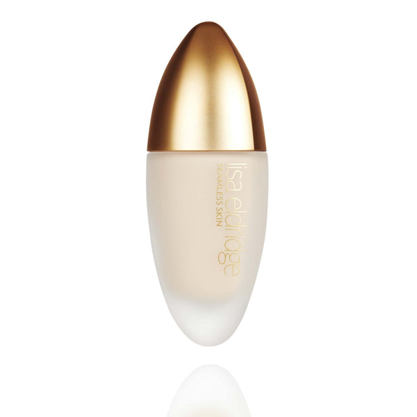Lisa Eldridge Seamless Skin Foundation in a matte glass bottle with a gold lid. The bottle says ‘Lisa eldridge SEAMLESS SKIN’