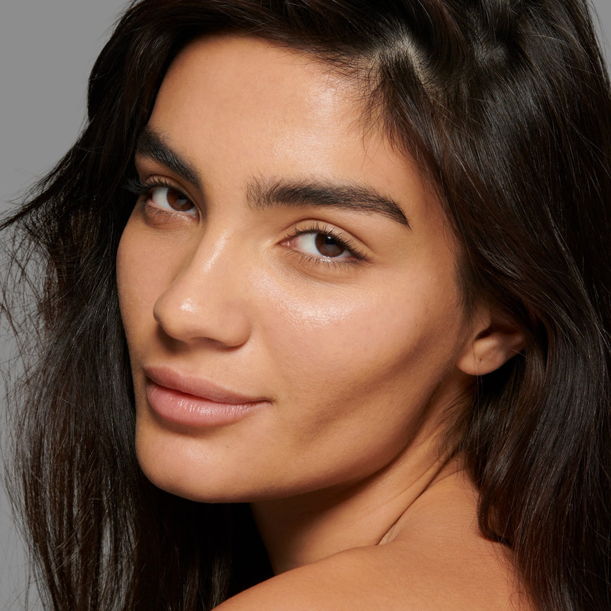 Lisa Eldridge Seamless Skin Foundation Pictured on Model. The model has light/medium skin and neutral golden undertones, brown eyes and straight black hair.