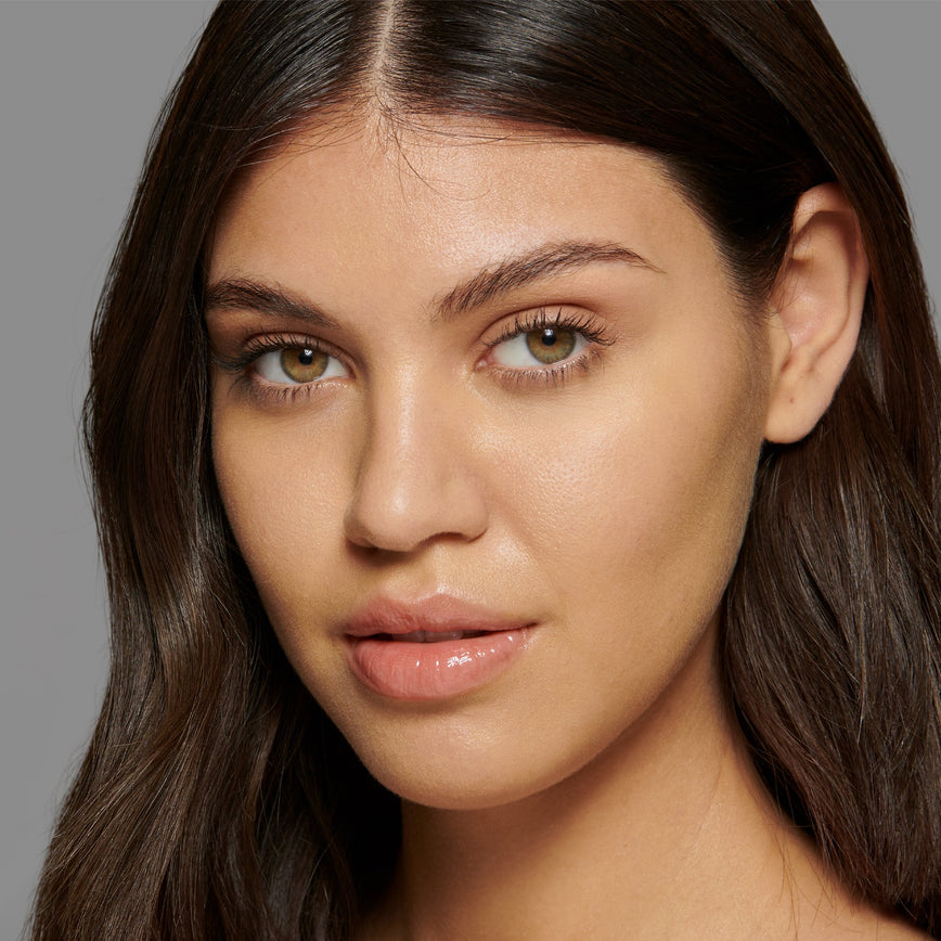 Lisa Eldridge Seamless Skin Foundation Pictured on Model. The model has light/medium skin and olive undertones, green/hazel eyes and straight dark brown hair.