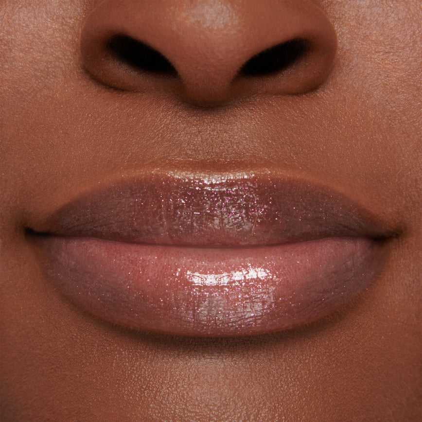 model wearing Gloss Embrace Lip Gloss in shade Dancing Rose