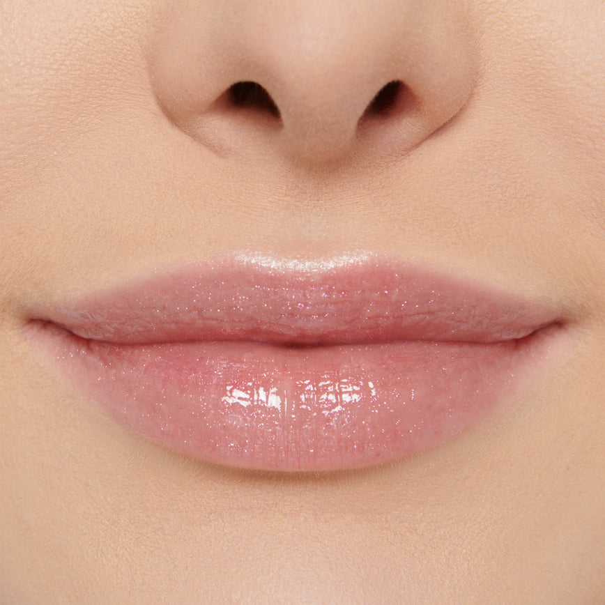 model wearing Gloss Embrace Lip Gloss in shade Dancing Rose