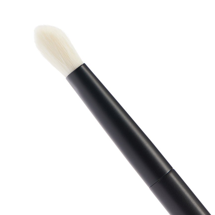 Close up of the No. 9 Seamless Blend Brush. You can see the long, tapered white bristles